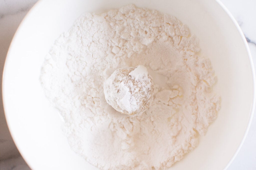 powdered sugar covered healthy snowball cookie