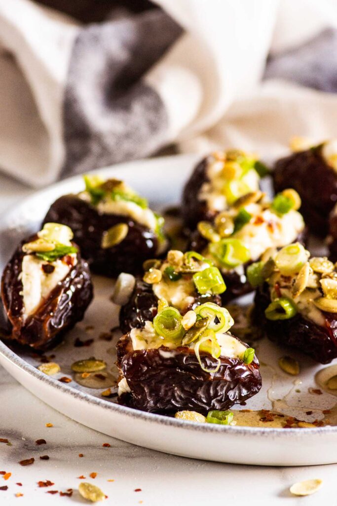 stuffed dates with boursin cheese on a platter for serving
