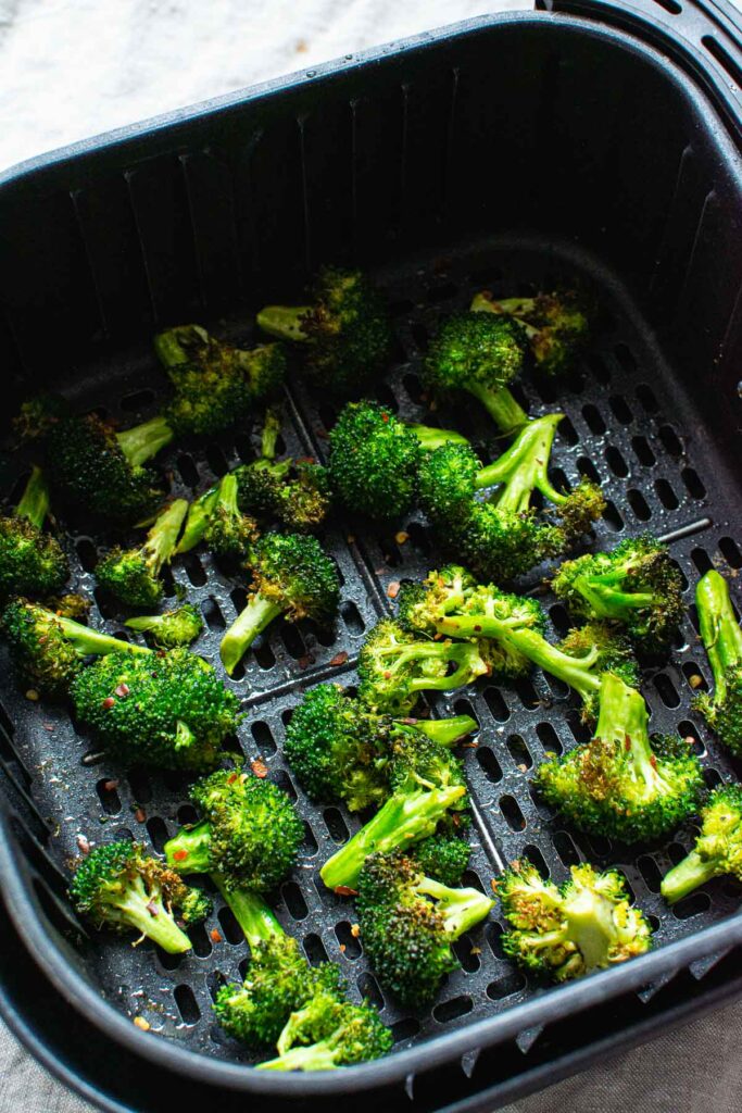 air fryer broccoli in a black basket