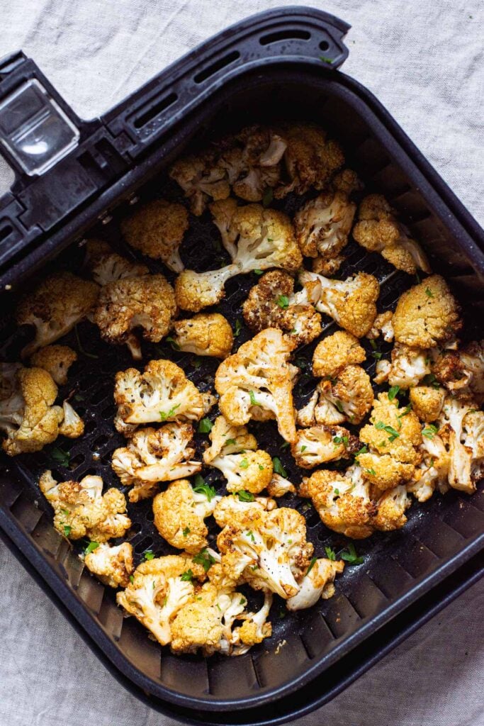 air fried cauliflower in basked of air fryer