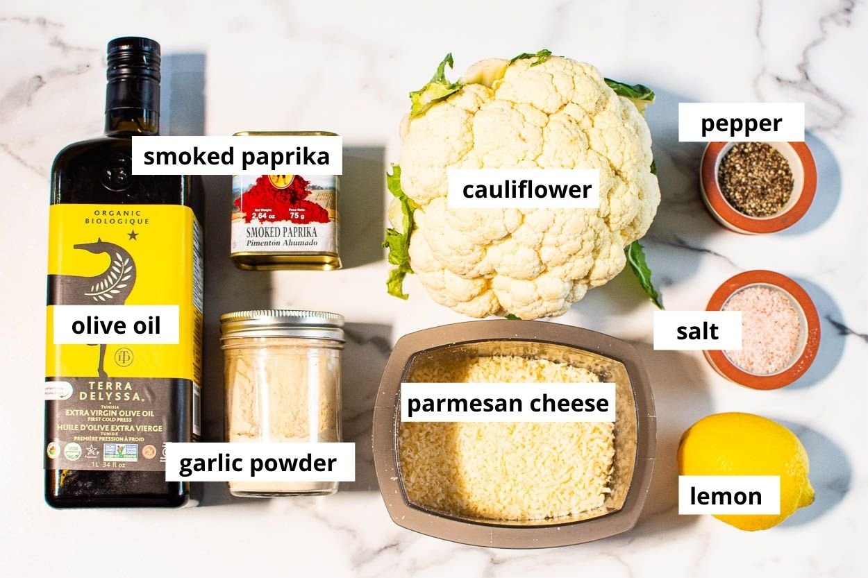 Cauliflower, lemon, parmesan cheese,  smoked paprika, garlic powder, salt and pepper, olive oil. 