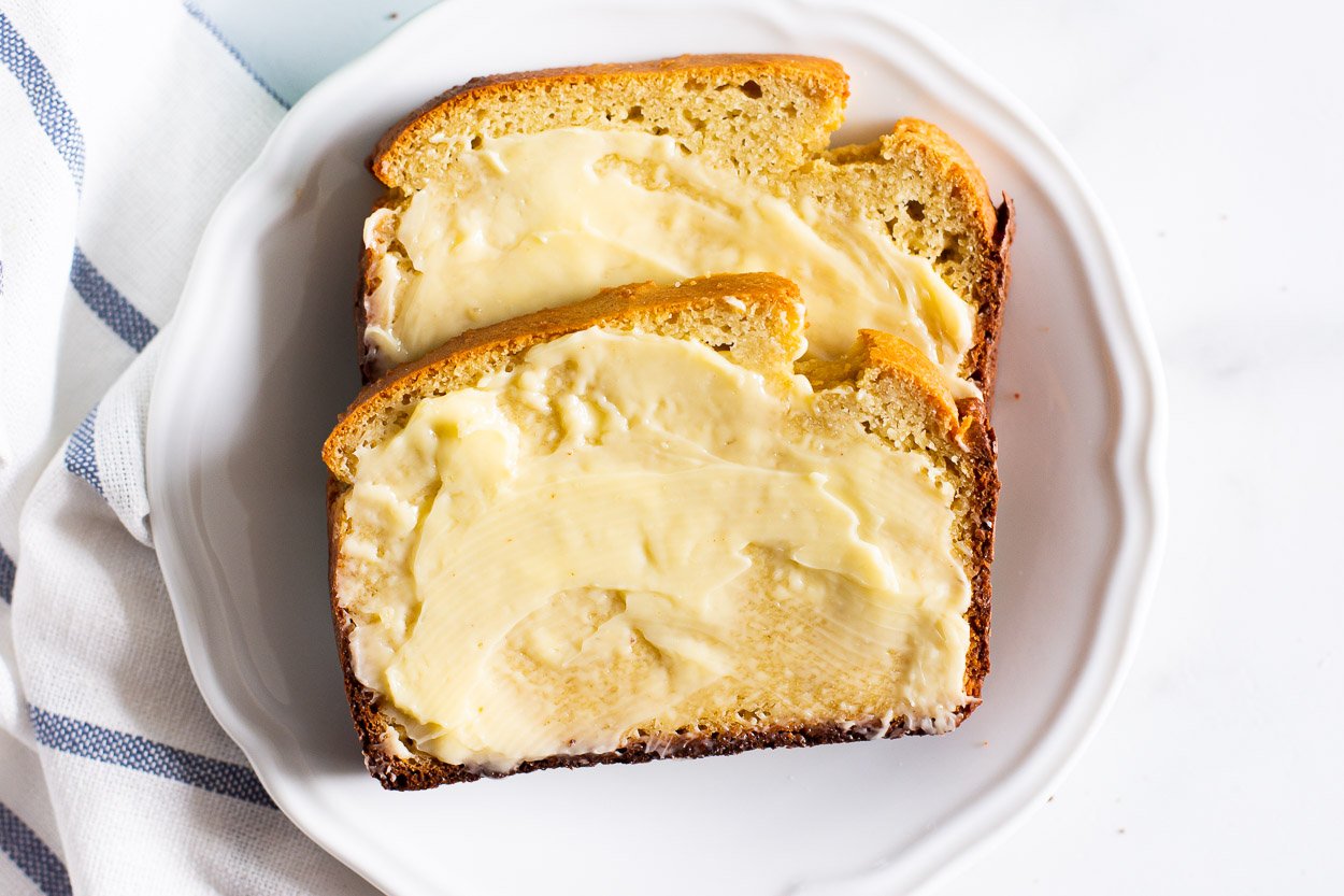 Almond flour bread with butter on a plate.