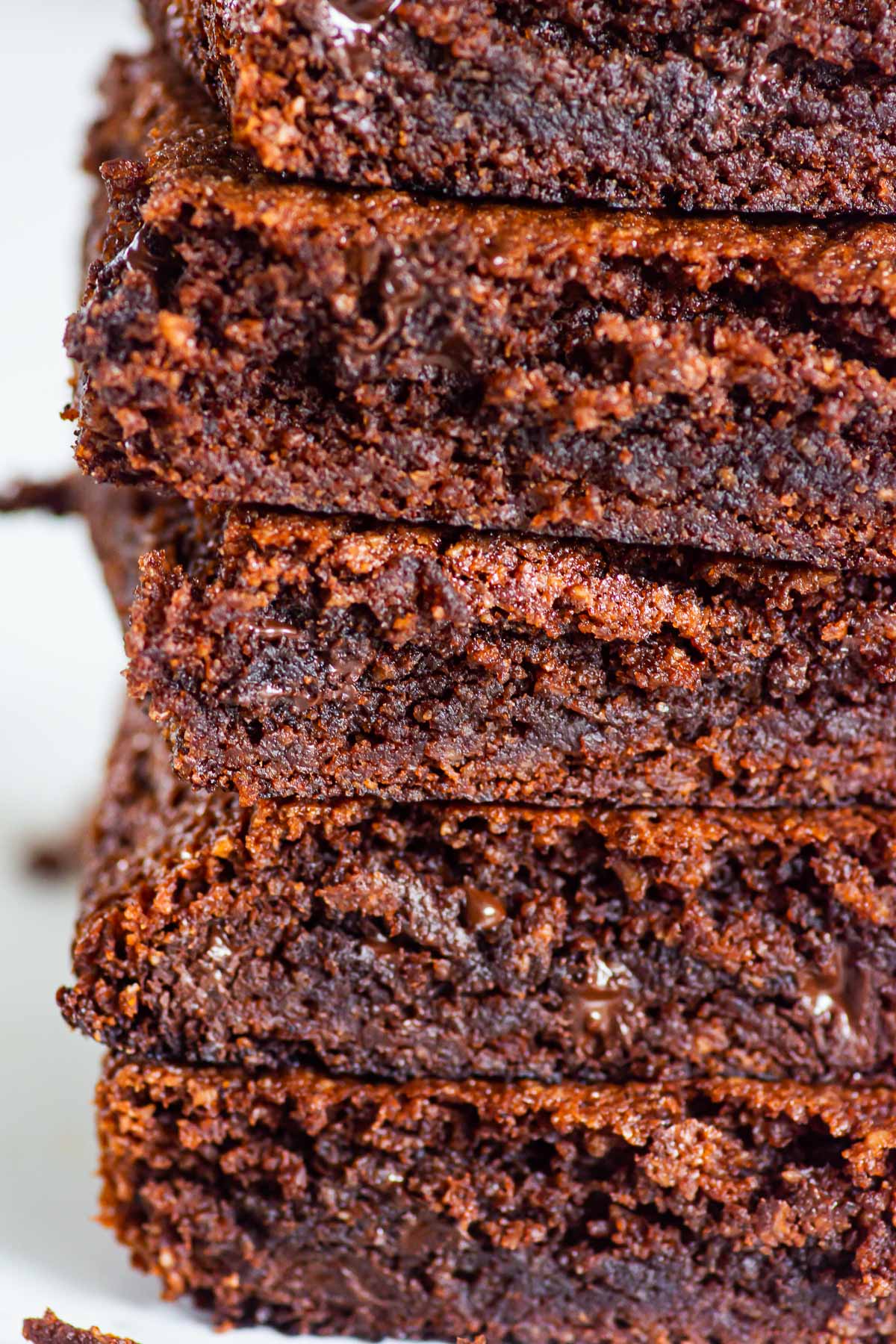 Close up of five stacked almond flour brownies.