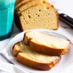 Almond flour bread slices with butter on a plate.