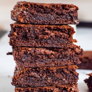 Almond flour brownies stacked on top of each other.