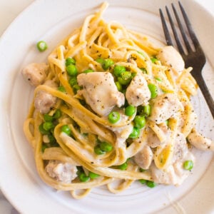 instant pot chicken alfredo on a plate with a fork