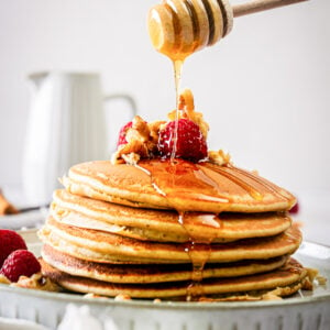 protein pancakes being drizzled with honey