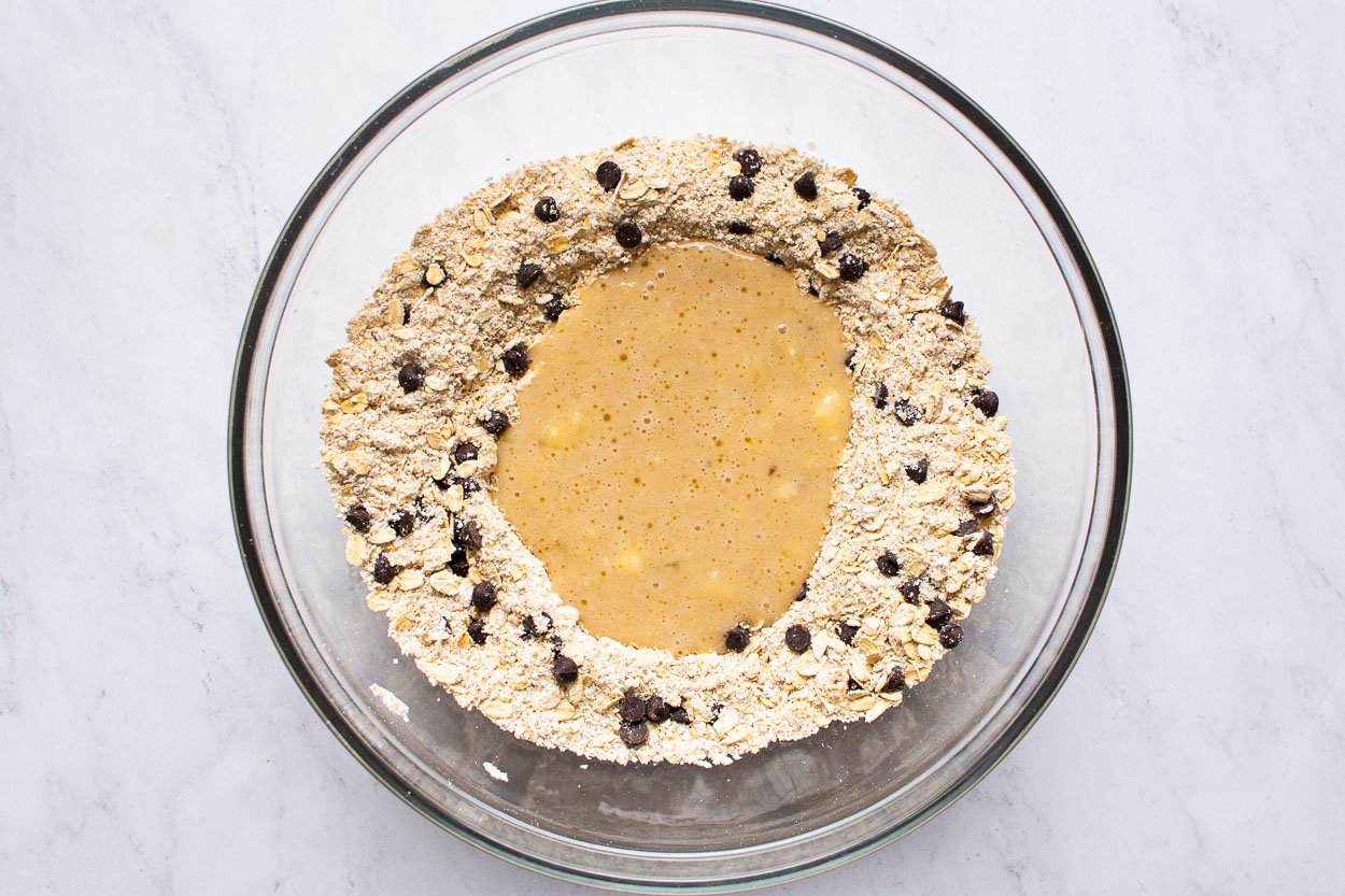 Mixing wet and dry ingredients for cookies. 