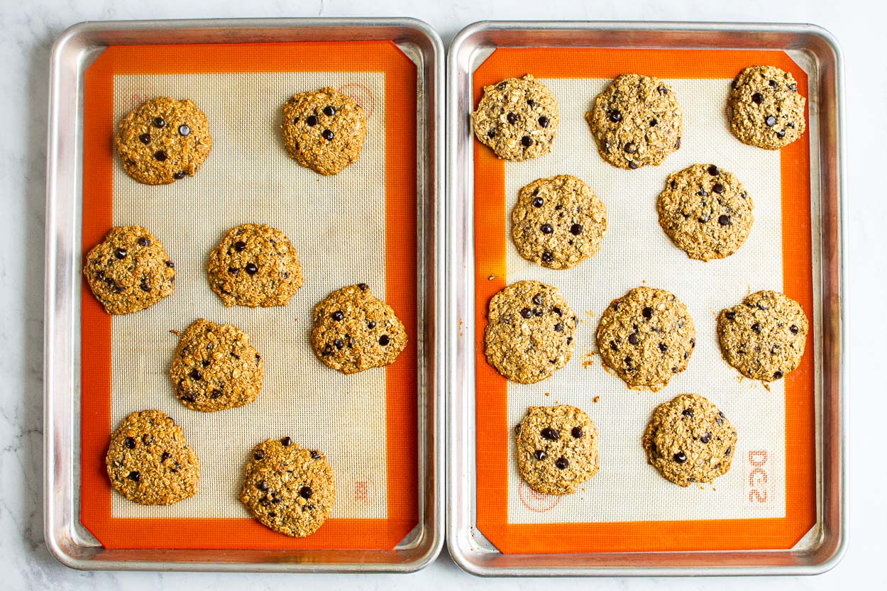 Healthy banana oatmeal cookies on two silpat lined baking sheets.