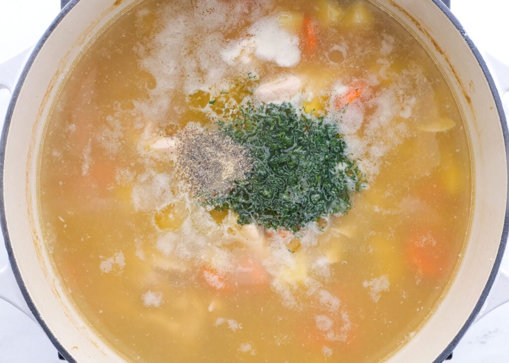 adding dill garlic at end of homestyle healthy chicken noodle soup