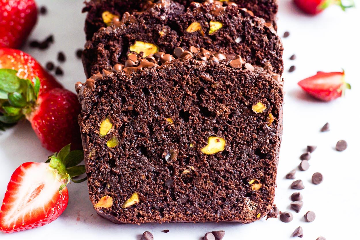 Healthy chocolate bread sliced with fresh strawberries.