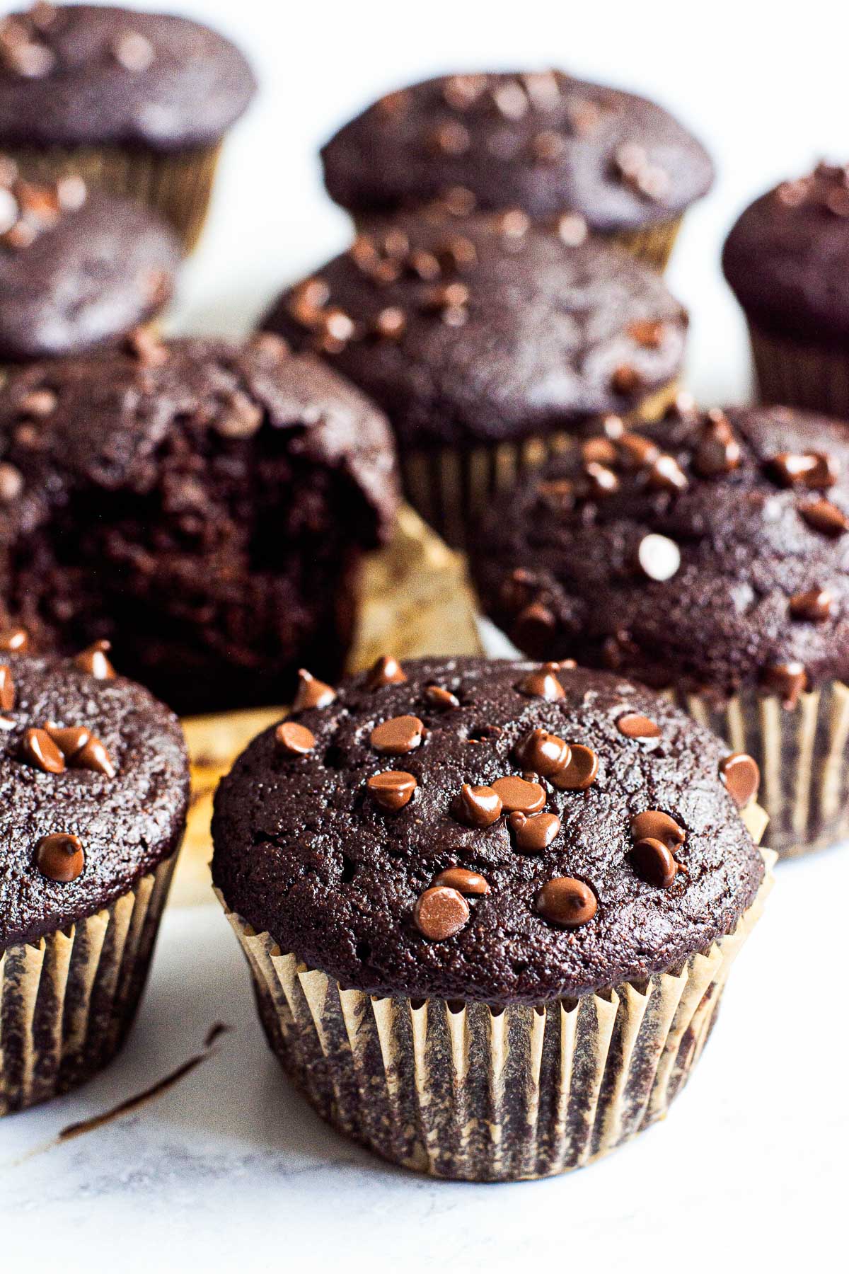 Healthy chocolate muffins in paper liners with mini chocolate chips.