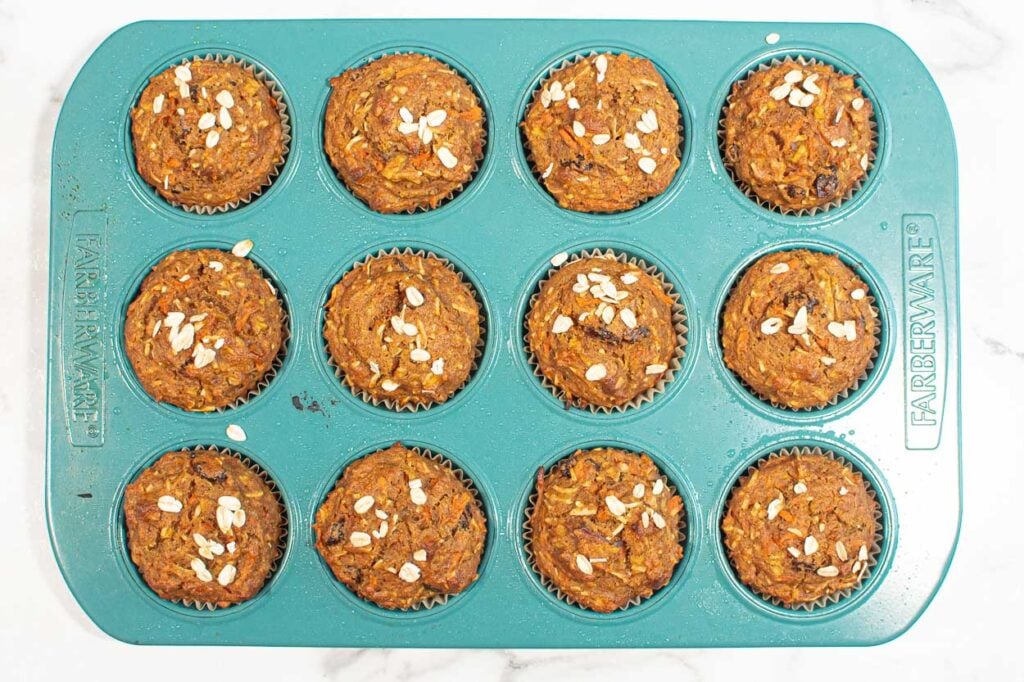 Baked healthy morning glory muffins in muffin tin.