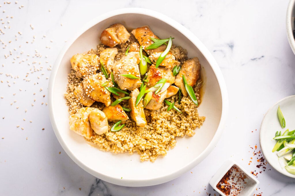 healthy orange chicken with quinoa in a bowl for serving
