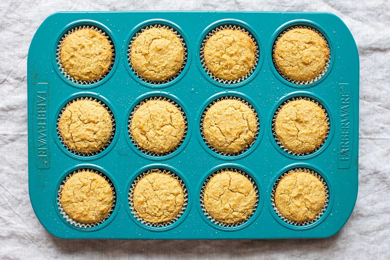 Baked healthy cupcakes in a blue muffin tin.