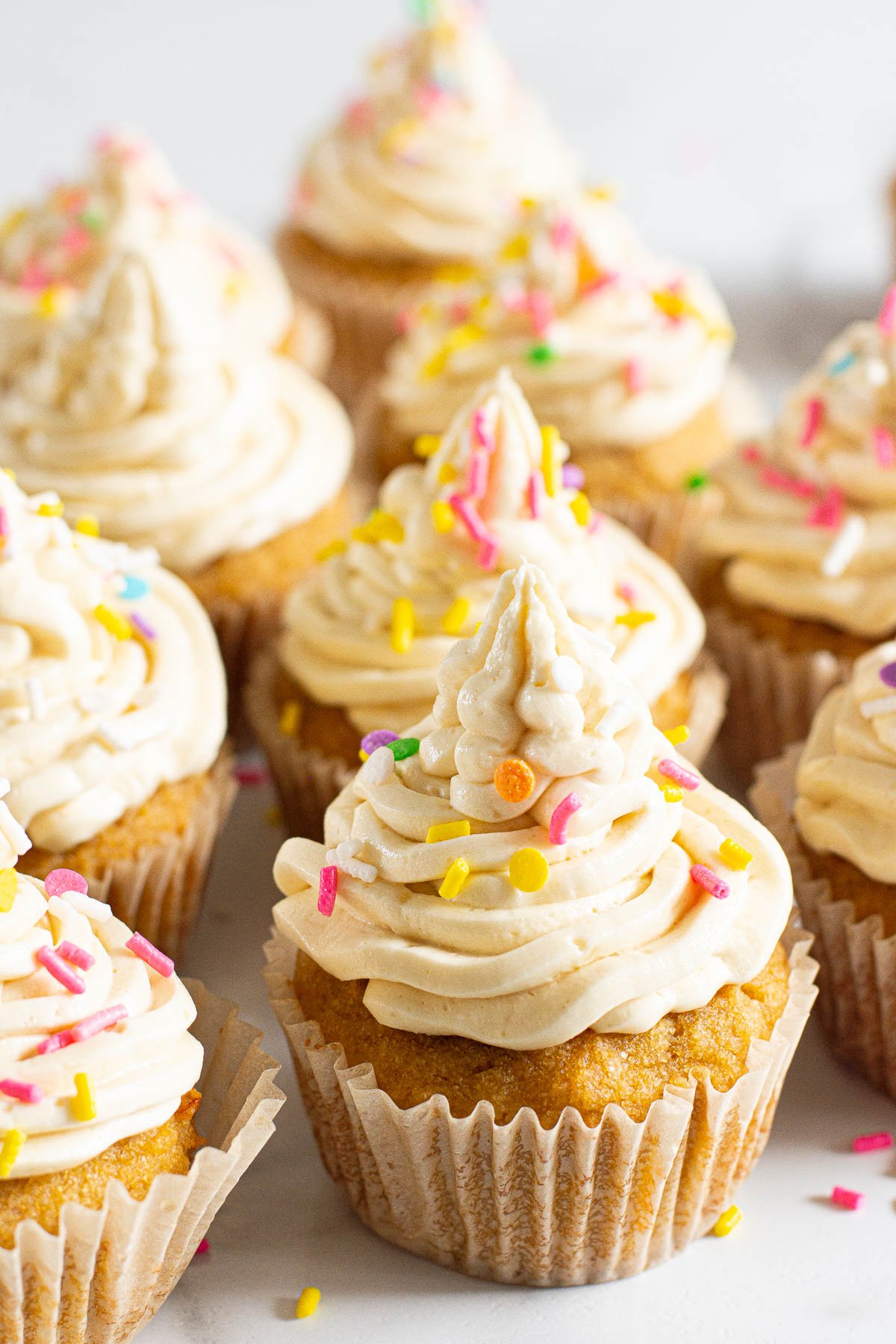 Healthy cupcakes topped with buttercream frosting and sprinkles.