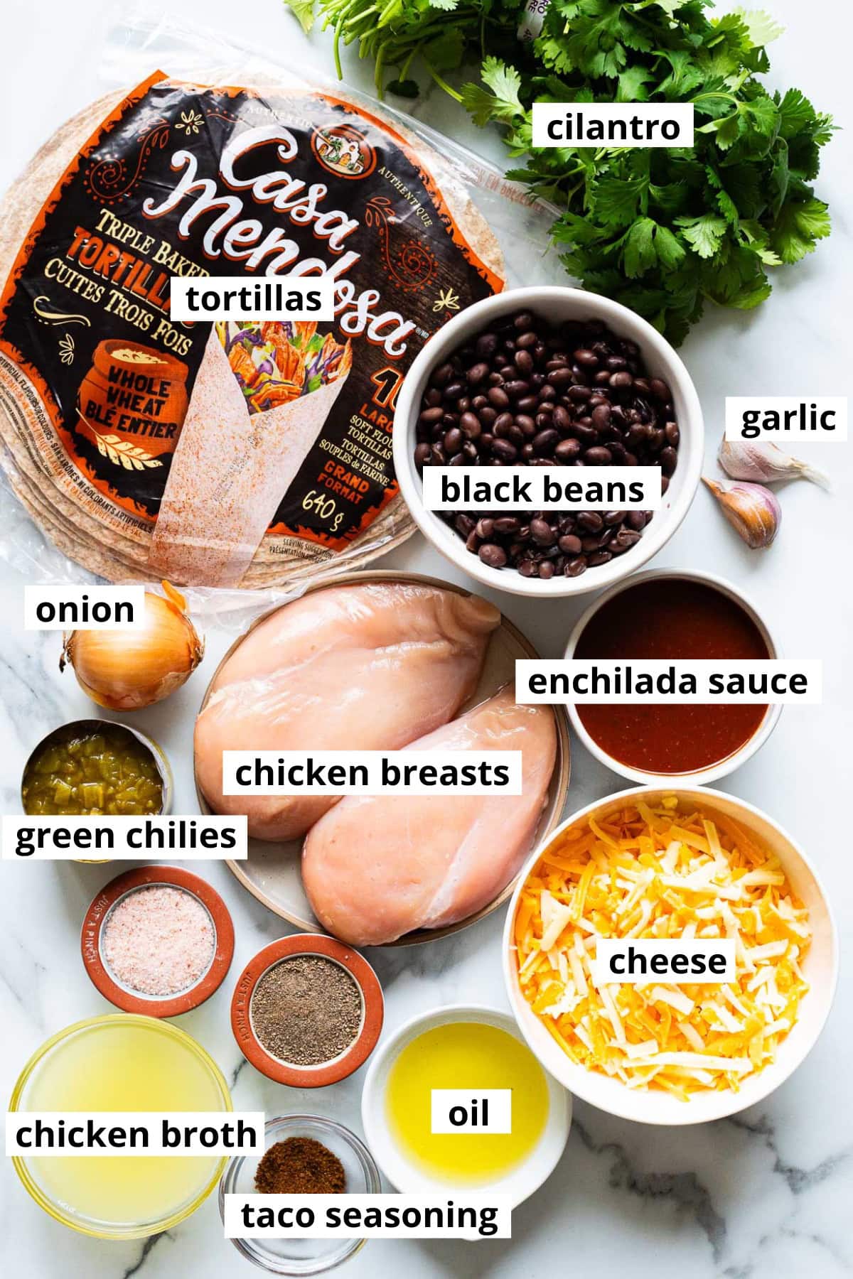 Chicken breasts, black beans, enchilada sauce, diced green chilies, cheese, taco seasoning, onion, garlic, oil, chicken broth, cilantro, whole wheat tortillas.