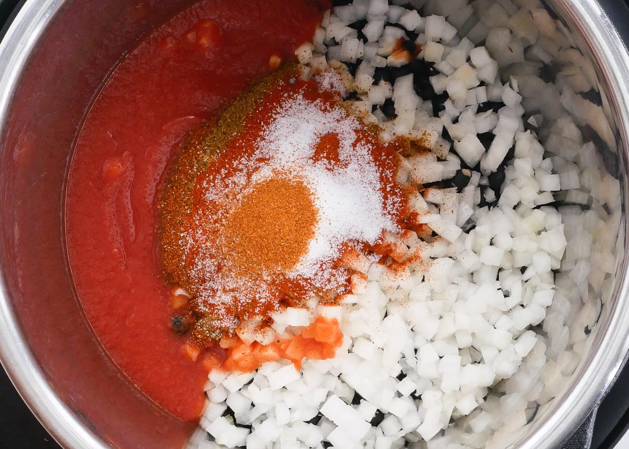 Tomato sauce, onion, black beans, spices in Instant Pot.