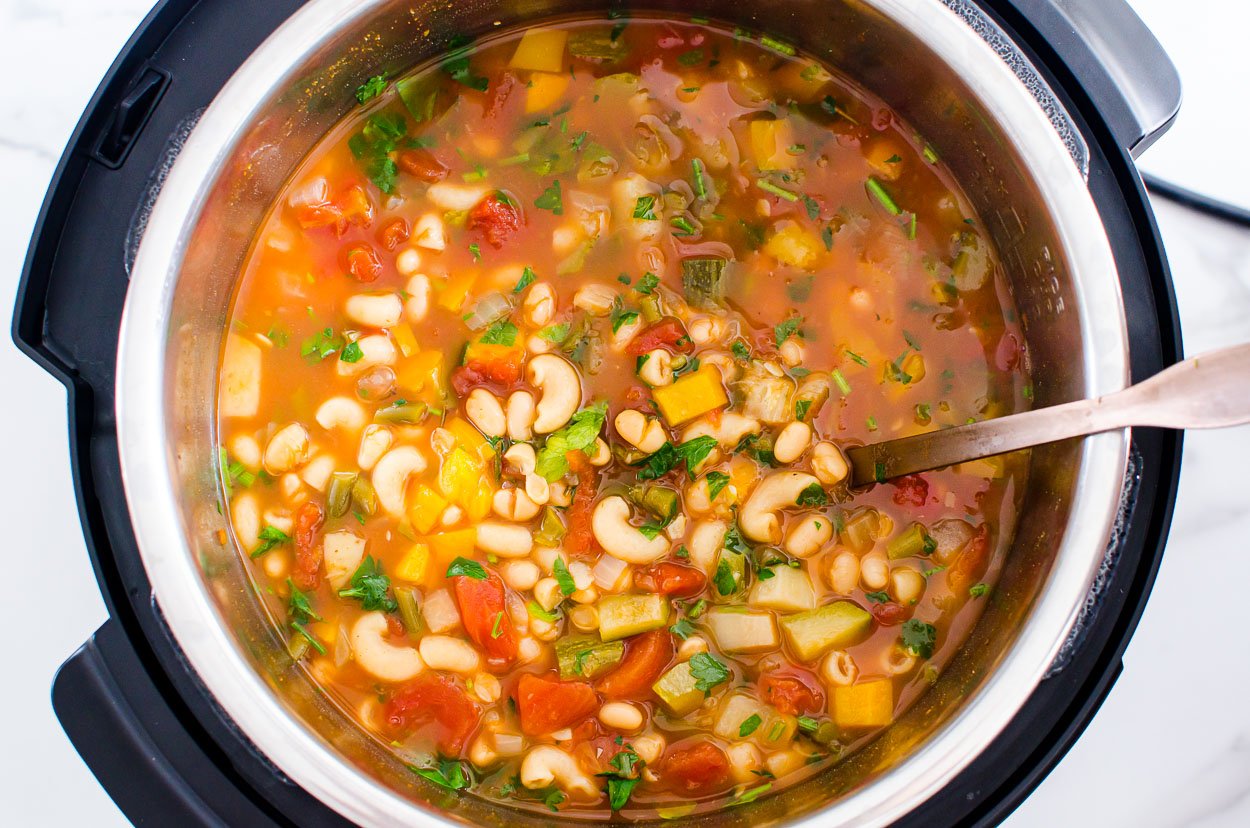 Instant Pot minestrone soup with ladle.