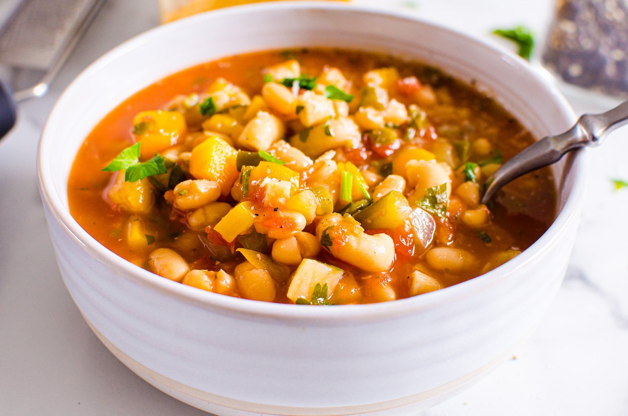 Instant Pot minestrone soup with beans and vegetables in a soup bowl.
