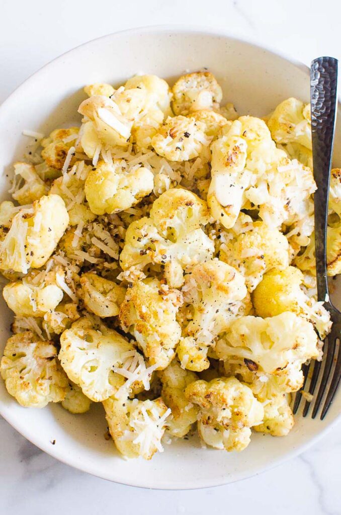 oven baked cauliflower with parmesan in a bowl