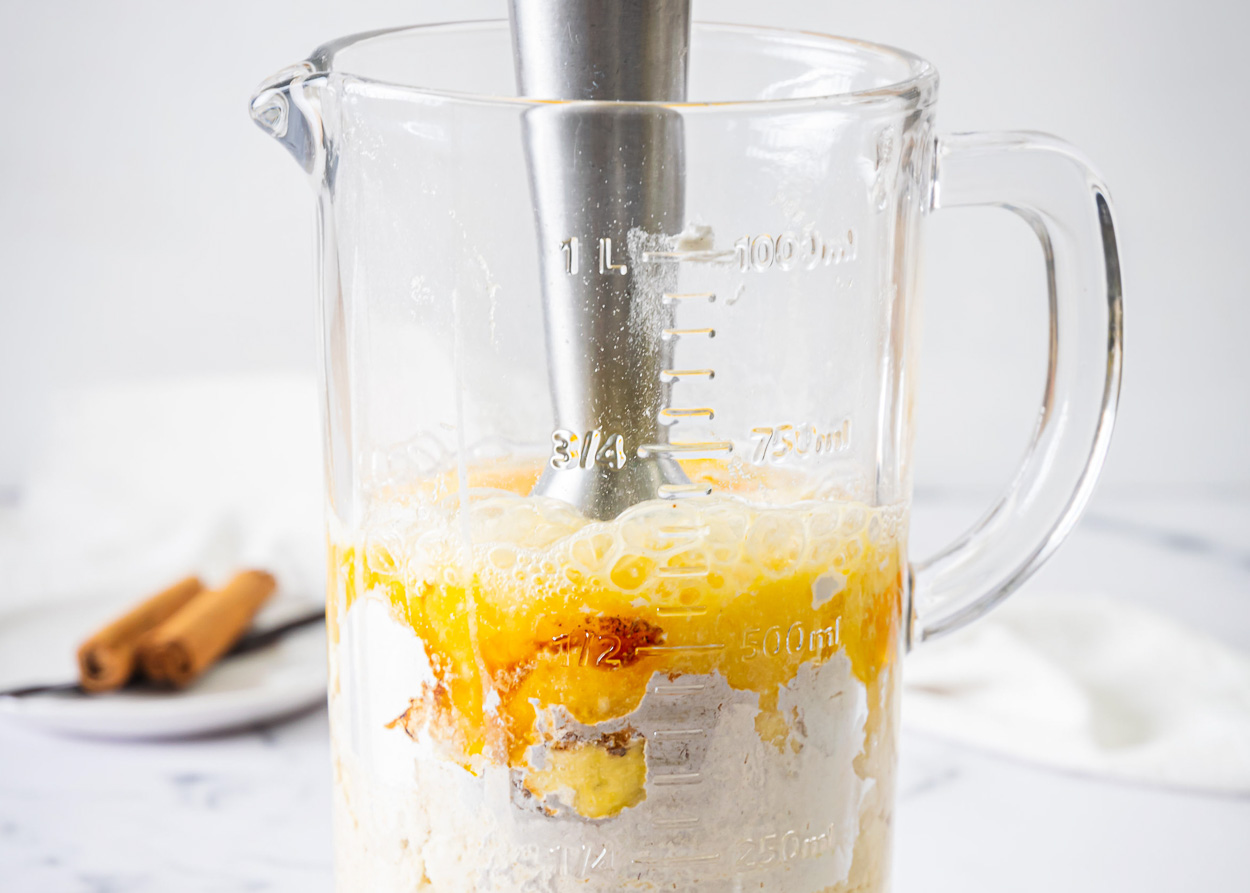 Bananas, eggs, protein powder, baking powder, cinnamon and vanilla blended in a cup of a blender.