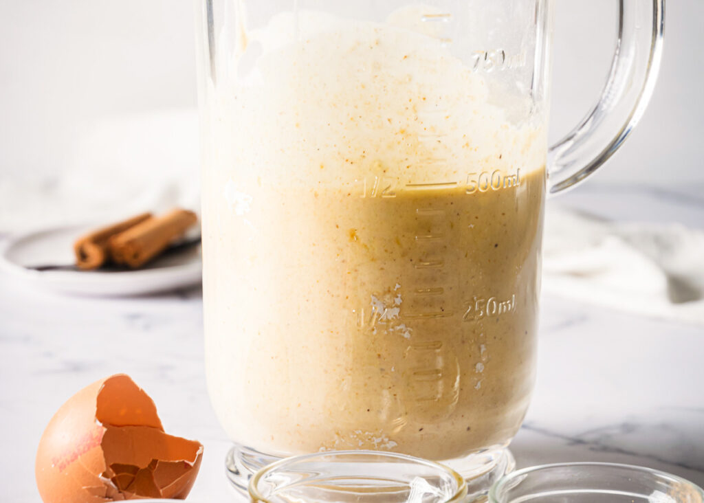 Blended egg protein powder mixture in measuring cup. 