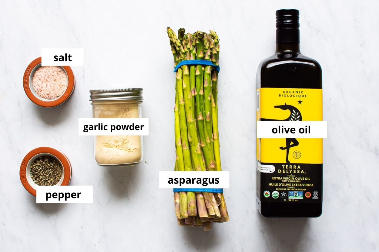 Olive oil, garlic powder, asparagus, salt and pepper.