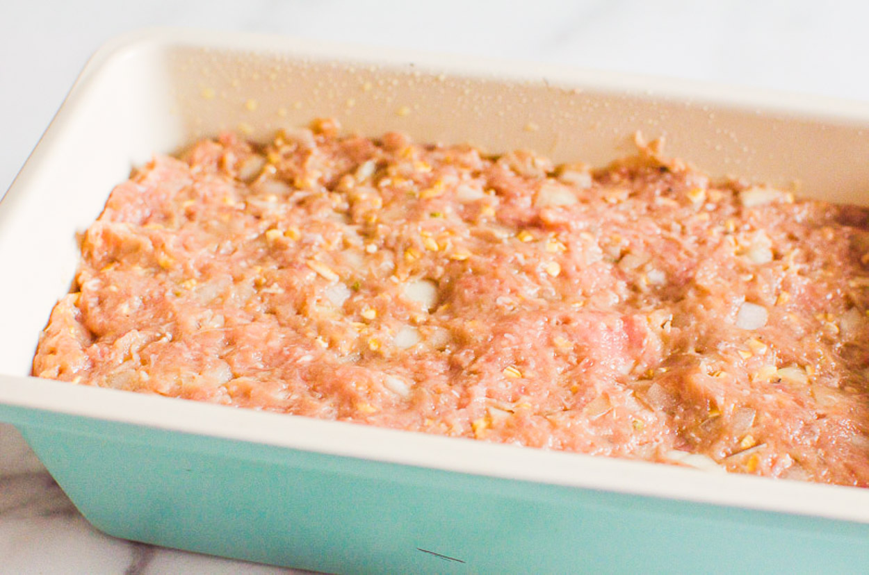 ground turkey meatloaf mixture in a loaf pan before baking