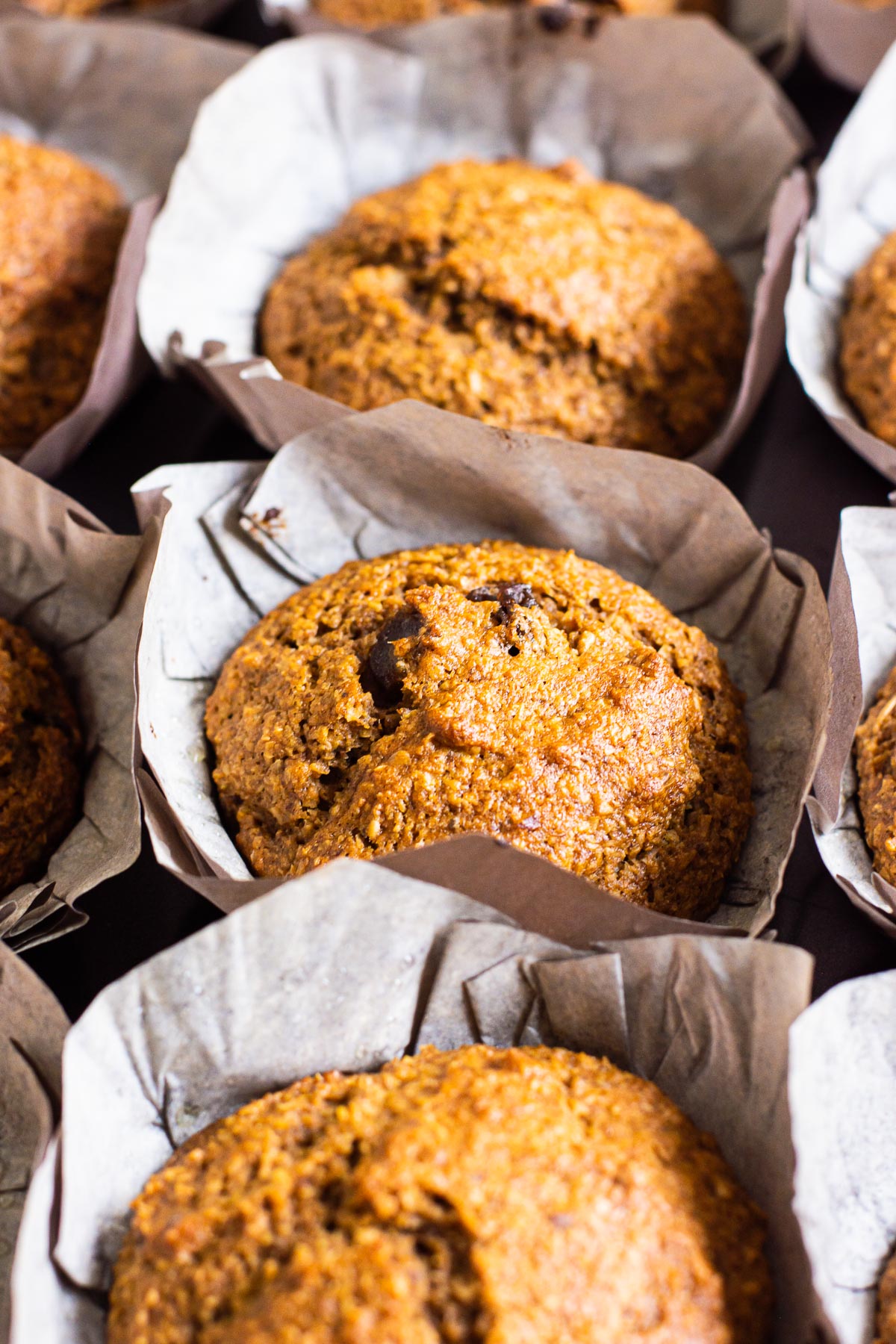 Healthy oat bran muffins recipe in parchment liners.