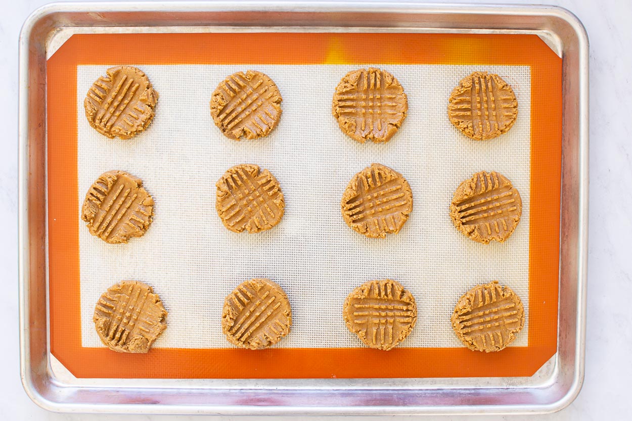 Healthy peanut butter cookies on a baking sheet ready to bake.