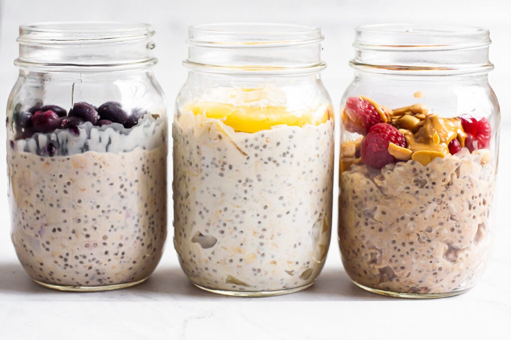 blueberry, tropical and pb and jam overnight oats in jars