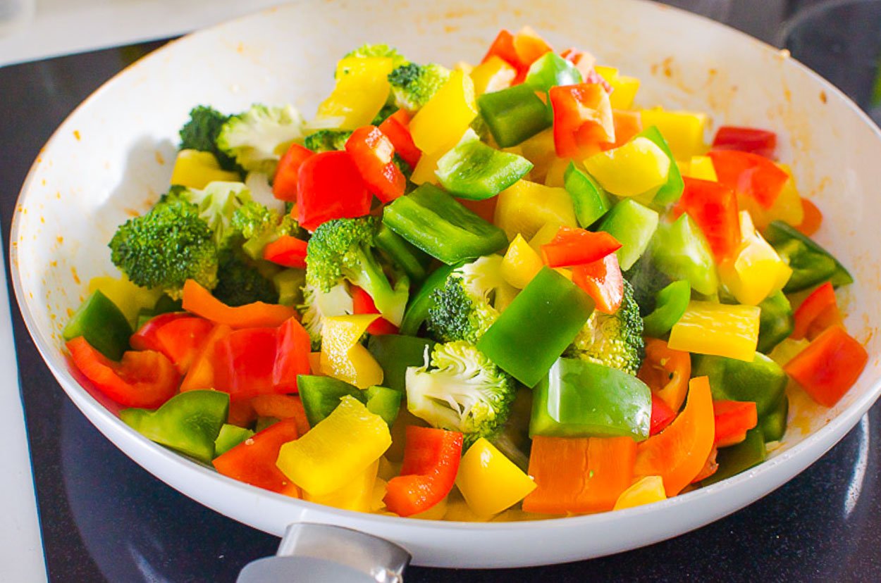 vegetables in skillet being stir fried