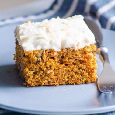 a slice of cake on a blue plate with a fork