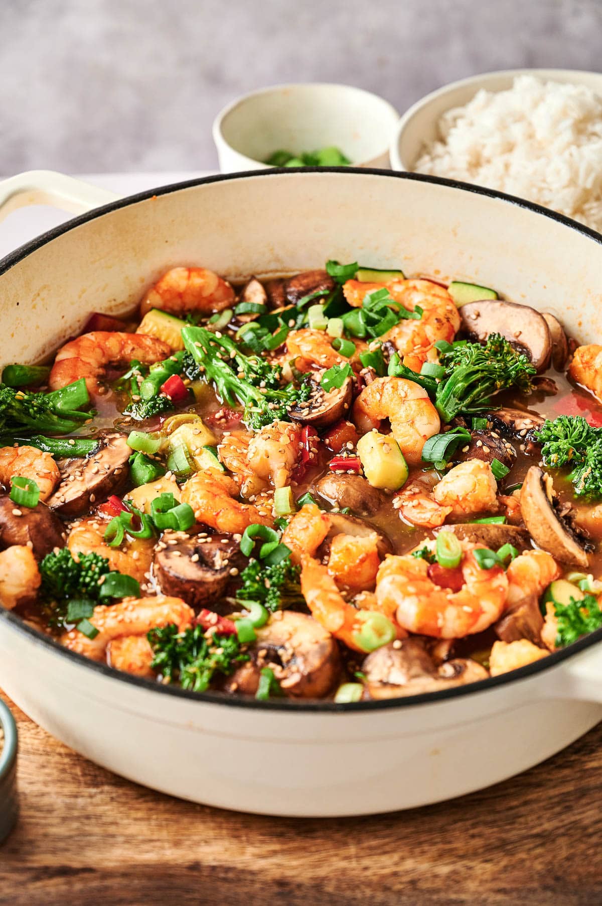 Side view of shrimp stir fry in a pan.