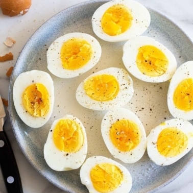 Peeled and sliced air fryer hard boiled eggs.