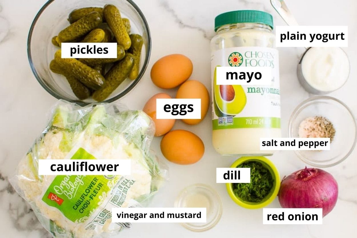 Cauliflower, mayo, plain yogurt, red onion, pickles, eggs, vinegar, mustard, salt, pepper, and dill.