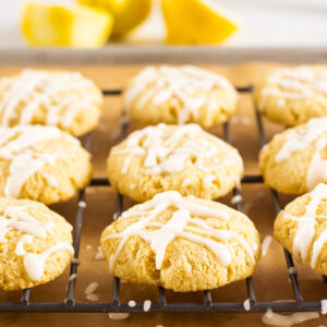 Healthy lemon cookies on baking rack drizzled with icing.