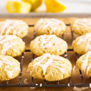 Healthy lemon cookies on baking rack drizzled with icing.