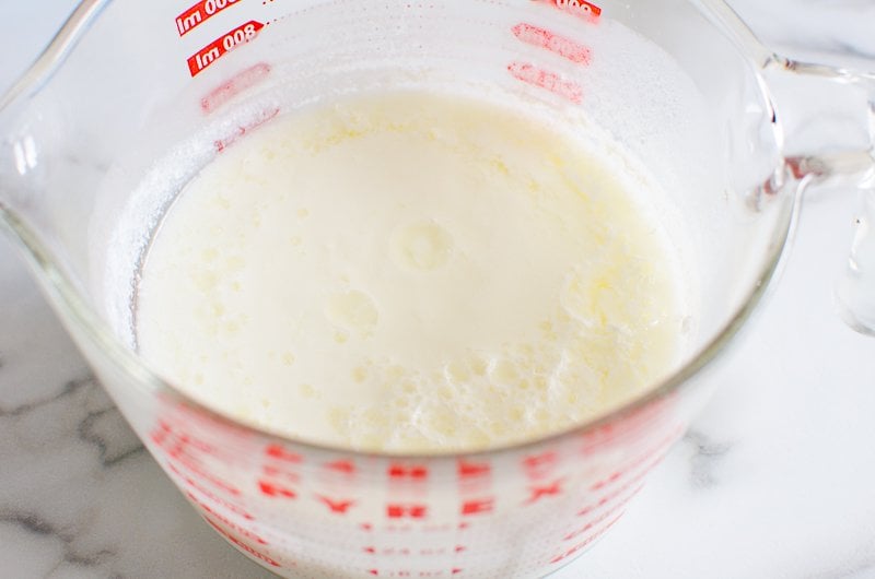 Milk and vinegar in a large glass measuring cup.