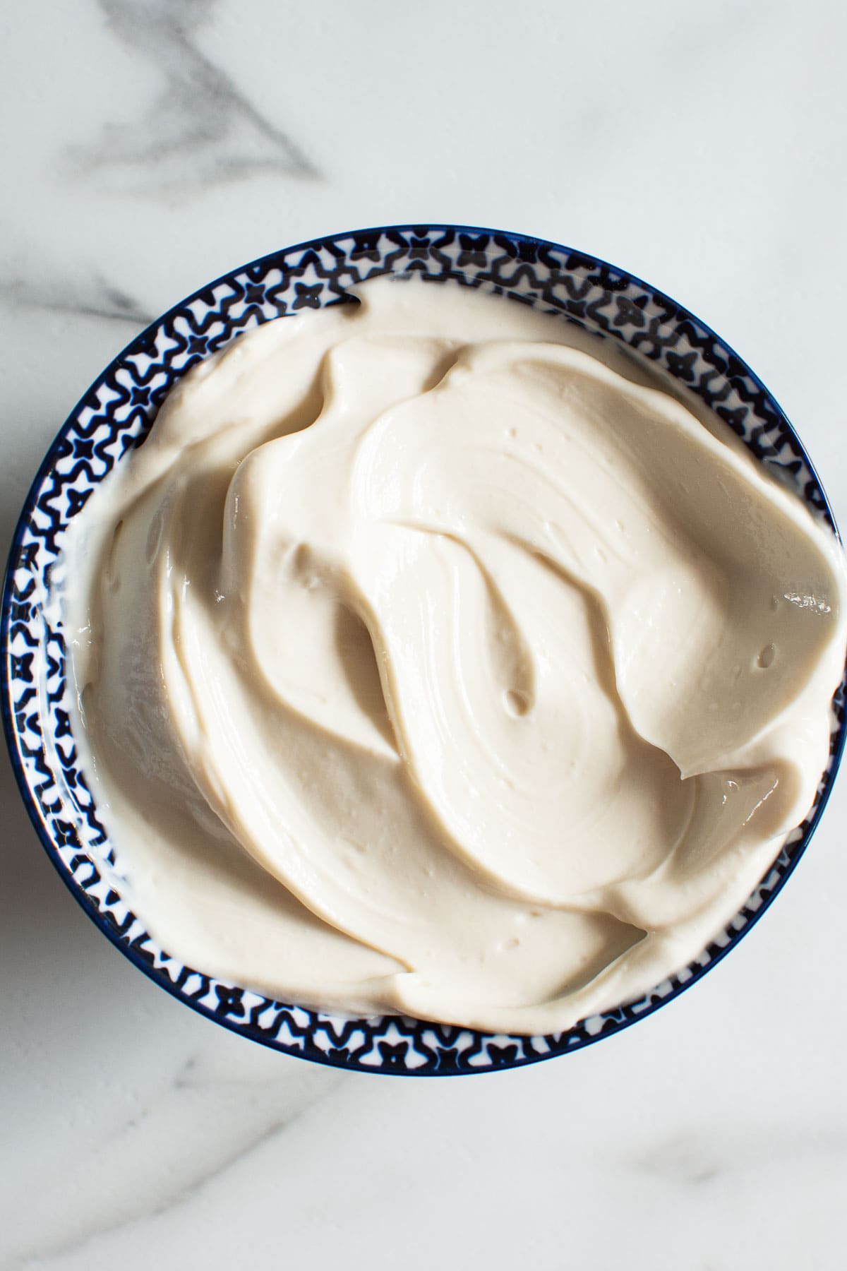 Healthy greek yogurt frosting in a bowl.