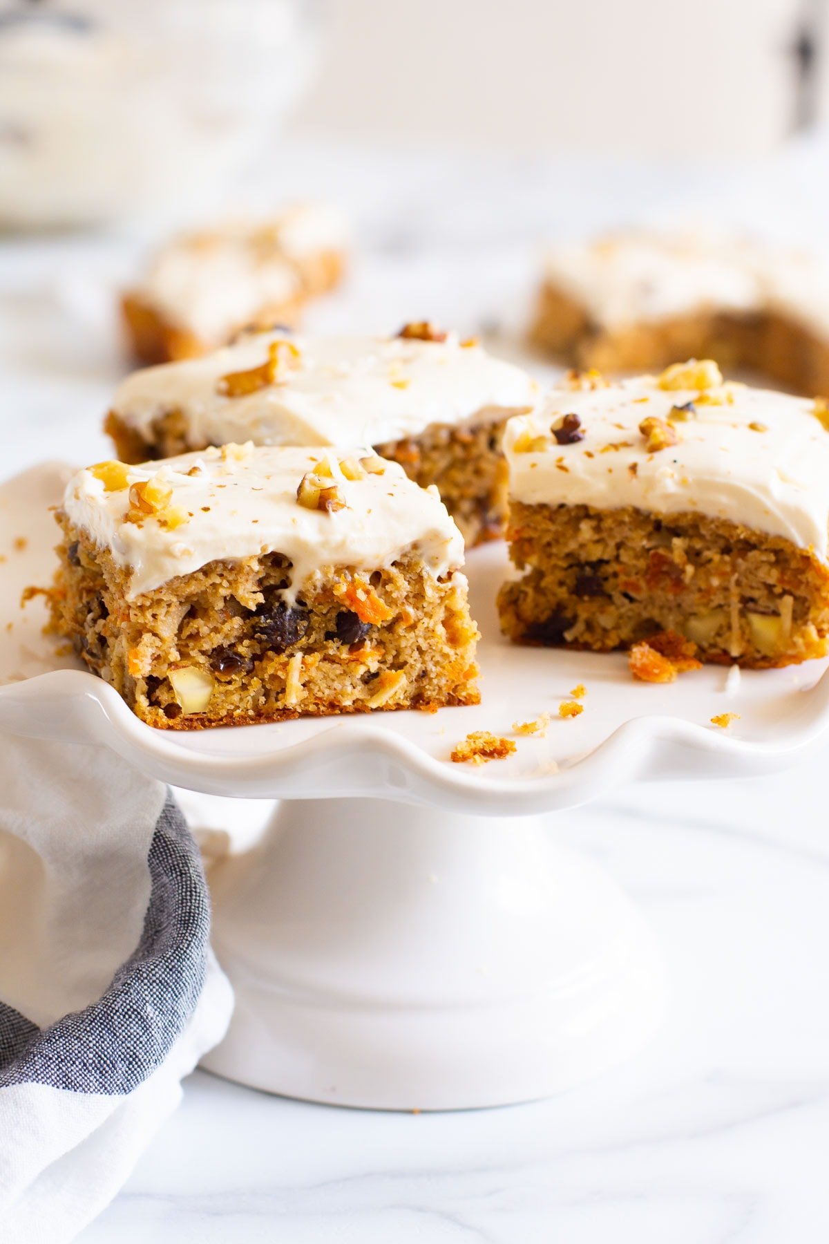 Healthy carrot cake bars on cake stand.