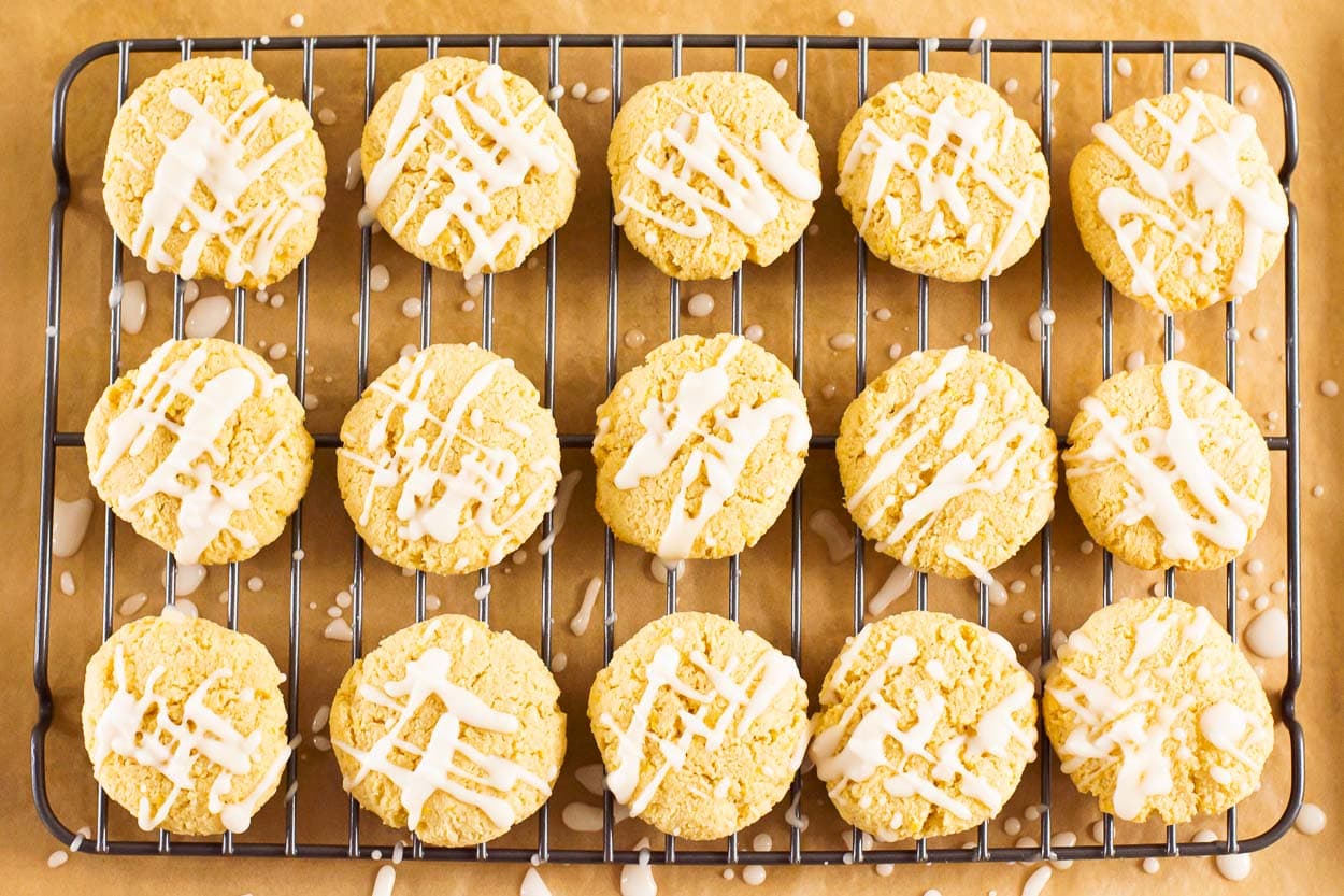 Healthy lemon cookies on baking rack with lemon glaze.