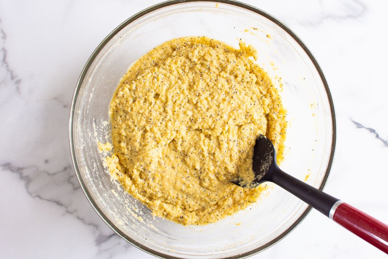 Almond flour batter with poppy seeds in a bowl. 