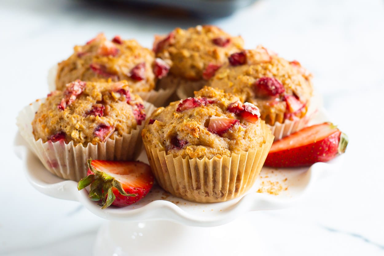 Healthy strawberry muffins on serving stand.
