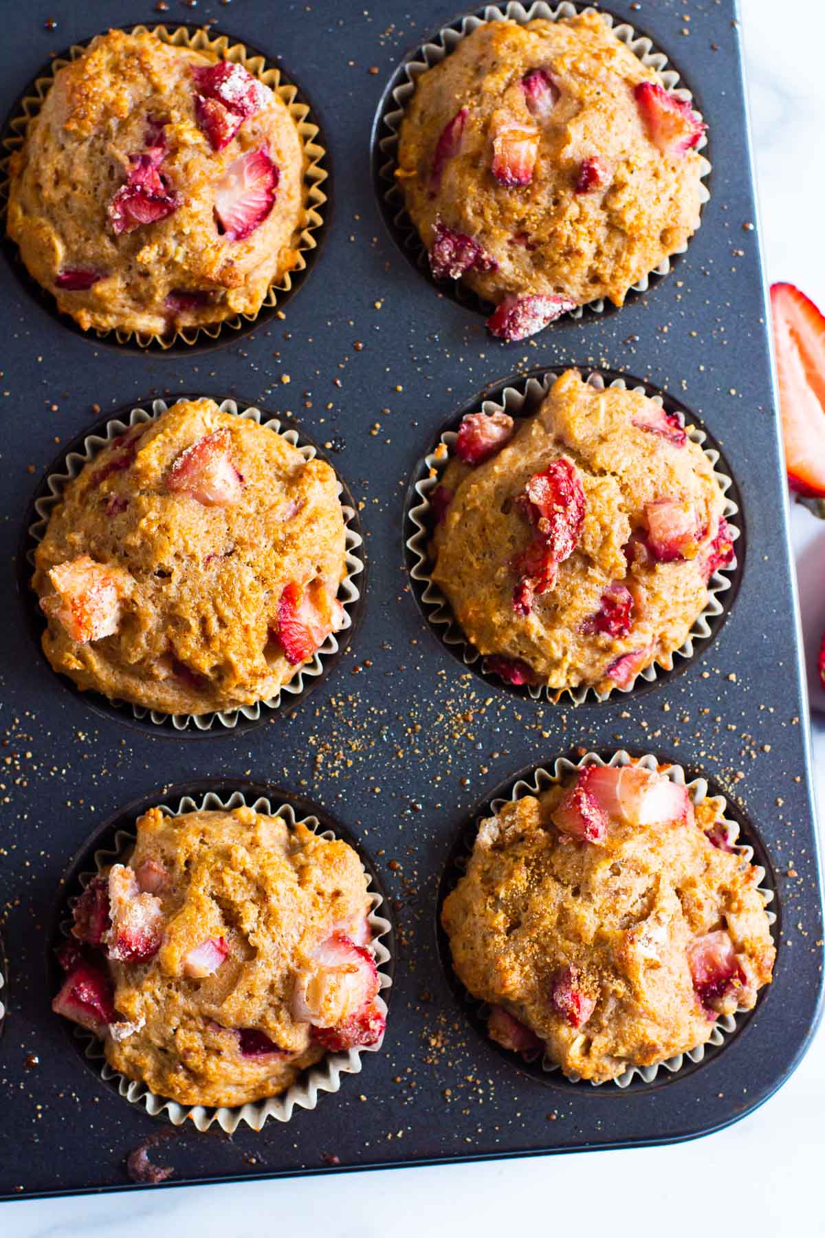 Muffin tin with healthy strawberry muffins.