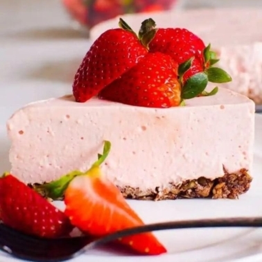 A slice of no bake strawberry cheesecake.