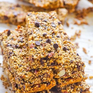 A stack of quinoa granola bars with chocolate chips.