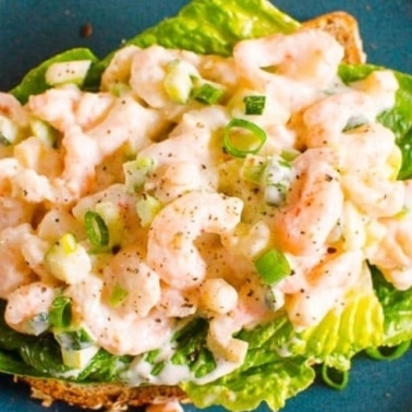 Healthy shrimp salad on a blue plate