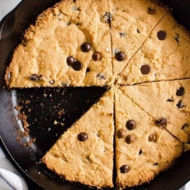 healthy skillet cookie with chocolate chips in cast iron skillet.